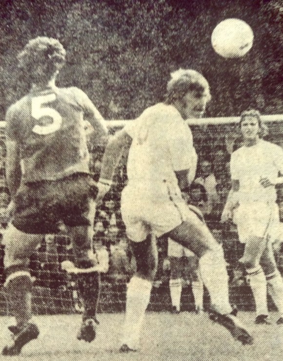 Fred Binney flashes a header wide after beating Derek Jeffries.