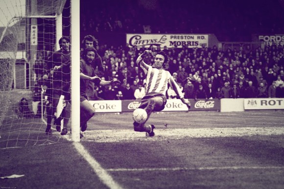Walton and Hersham goalkeeper Gary Bloom misses a cross, as Barry Bridges just fails to score at the near post.