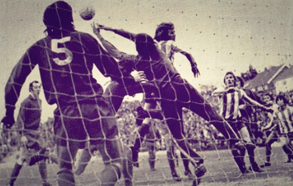 Ronnie Howell challenges for a high ball in the Walton goalmouth, with Lammie Robertson in attendance