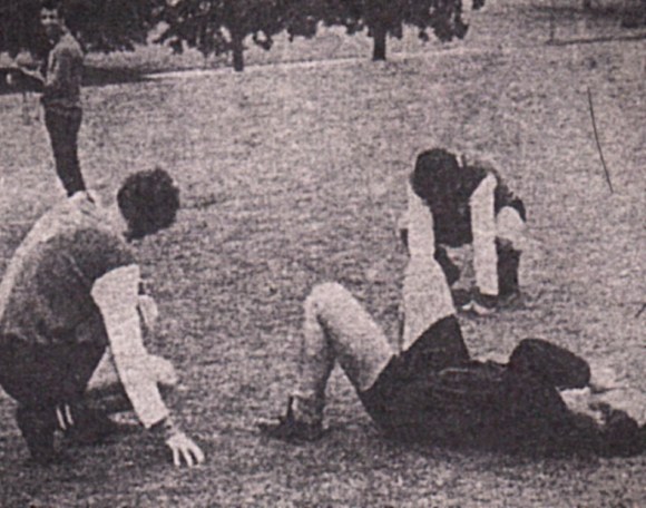 Geoff Sidebottom has collapsed, while Dave Turner (right) and Kit Napier sink to their knees.
